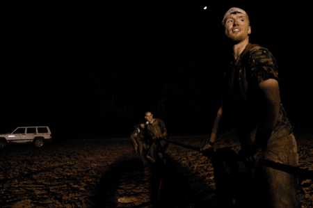 Junior Luke Pruett steadies the rope as Joel Polk & team get ready to take the other team down during the tug of war at Midnight Mudness. - Photo by Kathleen Murray