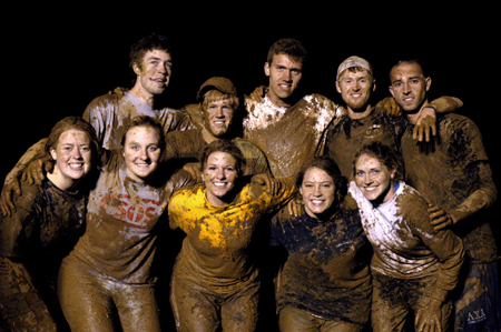 A Midnight Mudness team shows off their mudiness.  Pictured left to right: front row - Sarah Herzog, Kristin Veach, Stephanie Jones, Cameron Humble and Andrea Hofmann; back row - Kelly Reid, Becca Barkley, Chris Arnold, Luke Pruett and Joel Polk. - Photo by Kathleen Murray
