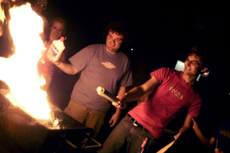 Freshmen Josh Clarke and Ronald Long live out their pyromaniac tendencies during finals week. - Photo by Jonathan Blair