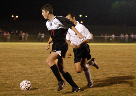 Brendon Kuhlman (17) tries to keep posession of the ball during a Union soccer match. - Photo by Kristen Hiller