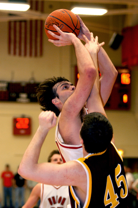Ben Frederick shoots over the defender as the Bulldog's took on Freed-Hardeman. - Photo by Jonathan Blair