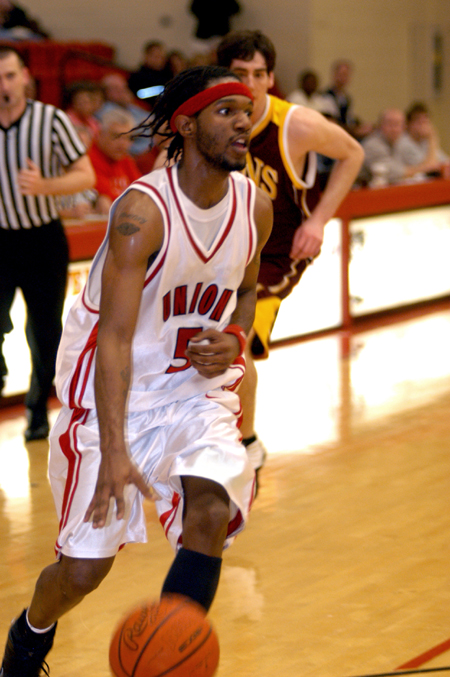 Marcus Cooper dribbles into the post as he checks his options during Union's contest versus Freed-Hardeman.
 - Photo by Jonathan Blair