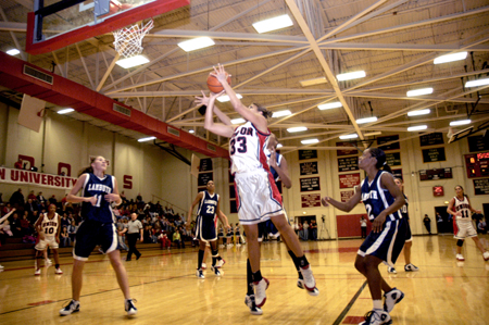Stephanie Clark takes the shot as she goes up against Lambuth's defenders. - Photo by Kathleen Murray