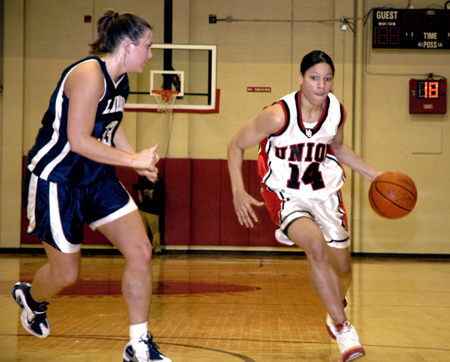 Tiffany Fisher drives to the hole as a Lambuth defender attempts to guard her. - Photo by Kathleen Murray