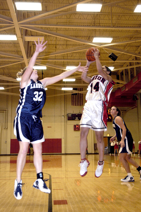 Junior Tiffany Fisher fades away as she shoots over a Lambuth player. - Photo by Steven Aldridge