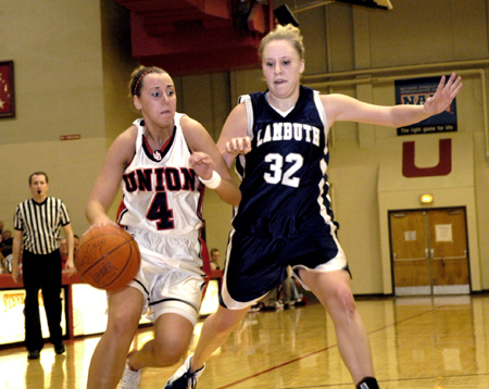 Whitney Tate drives past a Lambuth defender during Union's 71-38 victory.  - Photo by Kathleen Murray