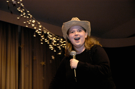 "Ooooooooooooklahoma" Senior Becky Johnson extendedly sings from her favorite broadway musical for the Variety Show. - Photo by Kathleen Murray