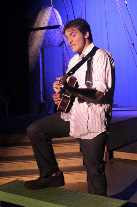 Patrick Myers as the Folk Singer in <i>Lilies of the Field</i>. - Photo by Jim Veneman