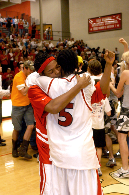 Marcus Cooper and Jonathan Givens embrace after a hard fought victory against Mountain State College. - Photo by Kristen Nicole Sayres