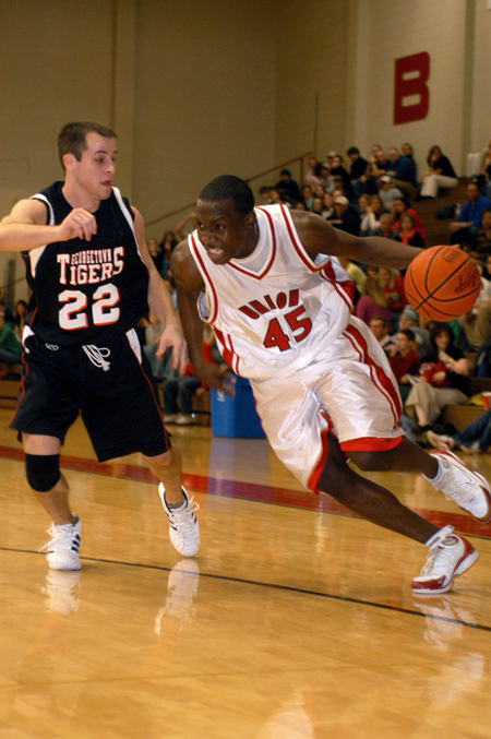 Corey Burkett makes his move to the hole as pressure is put on by Georgetown's defense.  - Photo by Kristen Nicole Sayres