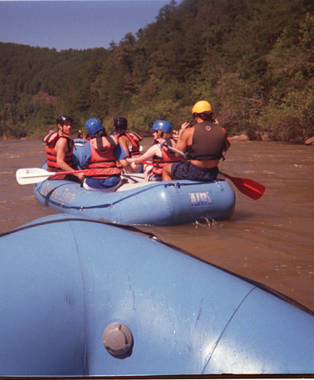 Student rafters enjoy the calm before the storm on the upper half of the Ocoee River during Adventure Programs' white water rafting trip. - Photo by Jonathan Blair