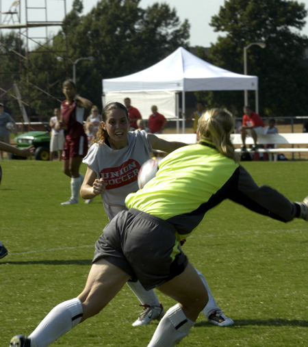 Freshman Nikki Burau looks on as the Freed-Hardeman goalie prepares to make the save. - Photo by Kathleen Murray