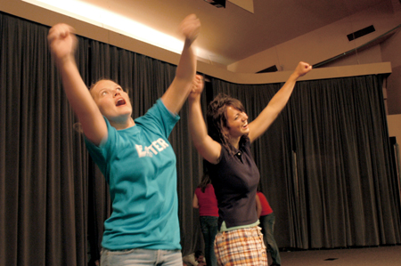 Senior Rachel Melton and Sophomore Lydia Livingston get pumped up before the Focus Show begins. - Photo by Brad Moore