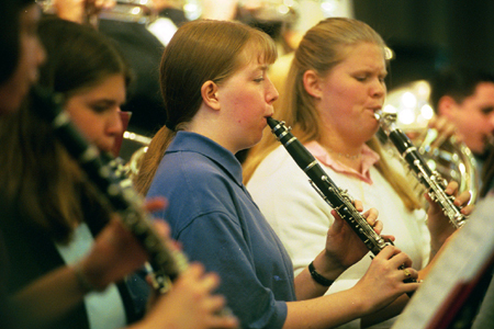 Senior Naomi Dodd and Freshman Kristen Merrill play the clarinet for the Symphonic Band during the Chuck Colson chapel service.
 - Photo by Jim Veneman