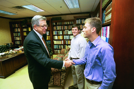 Sophomore Christian Ethics major Josh Howerton and Junior Theology major Marc Glass visit with Chuck Colson shortly before his chapel address. - Photo by Jim Veneman