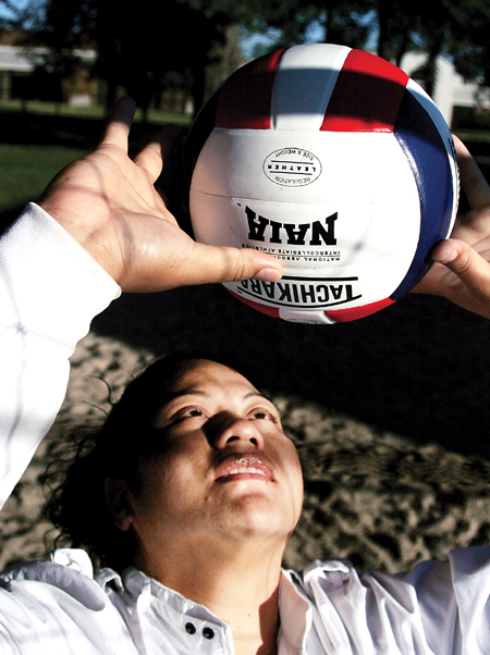 Junior outside hitter Monica Schirmer concentrates on a set. Concentration has assisted Schirmer in accumulating 146 kills for the Lady Bulldogs’ offense. - Photo by Kyle Kurlick