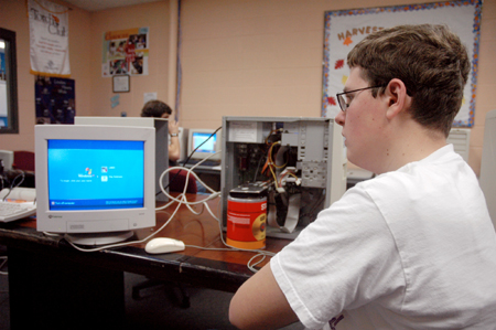 Freshman Matthew Dawson assists in a technology assessment at the Boys and Girls Club of Jackson during the Day of Remembrance. - Photo by Brad Moore