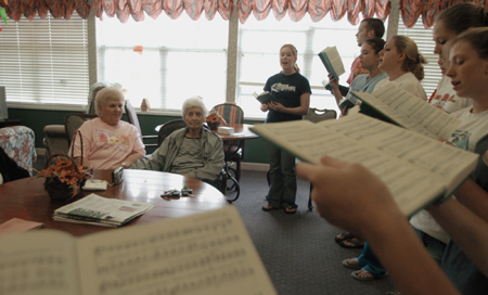 Choral students sang for residents at a local nursing home during their Day of Remembrance service project. - Photo by Heather Phillips