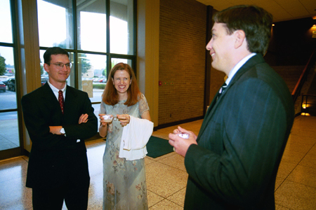 Assistant professor of chemistry Michael Salazar and his wife fellowship with Randy Johston, chair of the chemistry/physics department, prior to the Scholarship Banquet. - Photo by Jim Veneman
