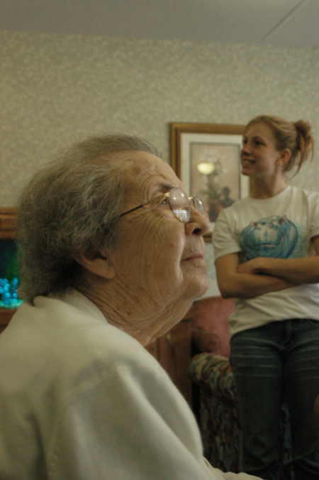During Remembrance Day a resident of a local nursing home enjoys the company of several Union students. - Photo by Heather Phillips