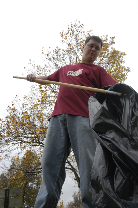 Neal Rager, coordinator of student leadership development, supervised a litter collection effort on campus during Day of Remembrance. - Photo by Kathleen Murray
