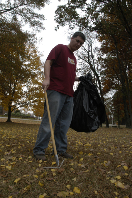 Neal Rager, coordinator of student leadership development, supervised a litter collection effort on campus during Day of Remembrance. - Photo by Kathleen Murray