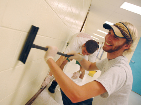 Junior John Kay and fellow Lambda Chi Alpha members cleaned walls at Whitehall Elementary during their Day of Remembrance work. - Photo by Kristen Nicole Sayres