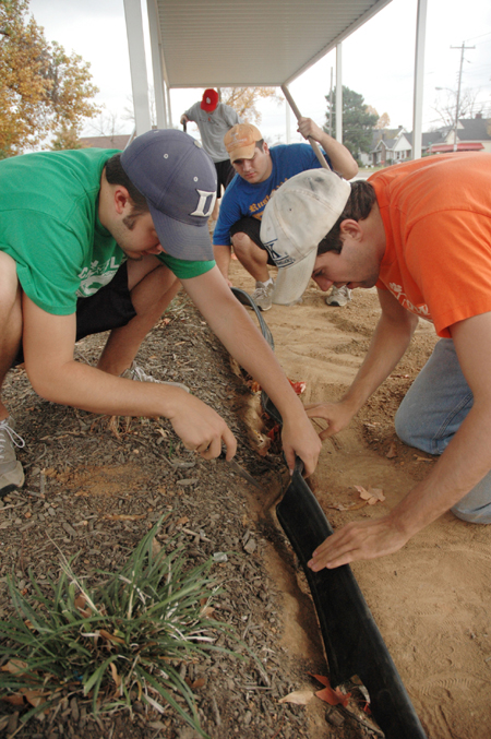 Trevor Castle and Micah Whitaker worked on the landscaping at Parkview Montessori during their Day of Remembrance service project. - Photo by Kristen Nicole Sayres
