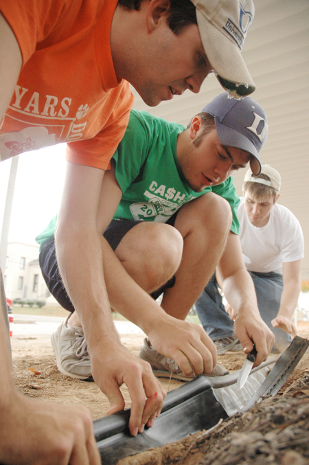 Micah Whitaker, Trevor Castle and Josh Webb worked on the landscaping at Parkview Montessori during their Day of Remembrance service project. - Photo by Kristen Nicole Sayres