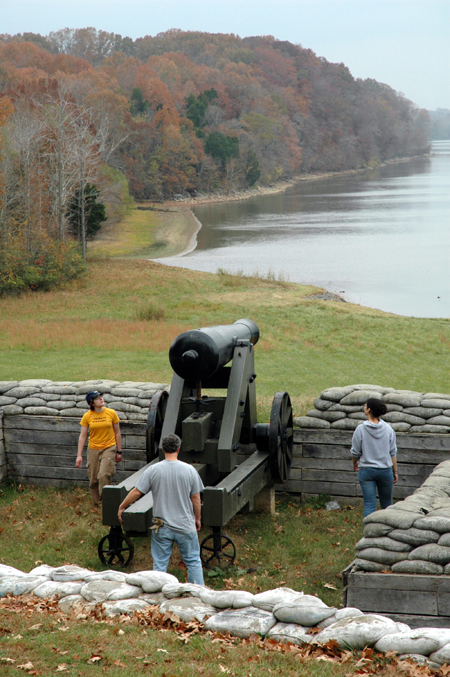 Jennifer May, Dr. David Thomas, and Sharon Hart look at a Civil War Confederate cannon on the Cumberland River at Fort Donelson National Battlefield after their Day of Remembrance service project. - Photo by Jim Veneman