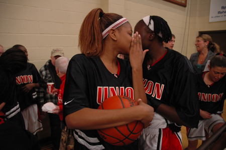 Natanya Smith (front) talks with fellow post player Josephine Owino prior to Union taking the court in the Jackson Rotary Classic. - Photo by Kristen Nicole Sayres