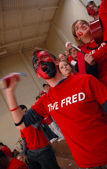 A freshly-painted Matt Taylor leads the cheering section in <em>The Fred</em> during a Lady Bulldog game against Lambuth. - Photo by Kristen Nicole Sayres