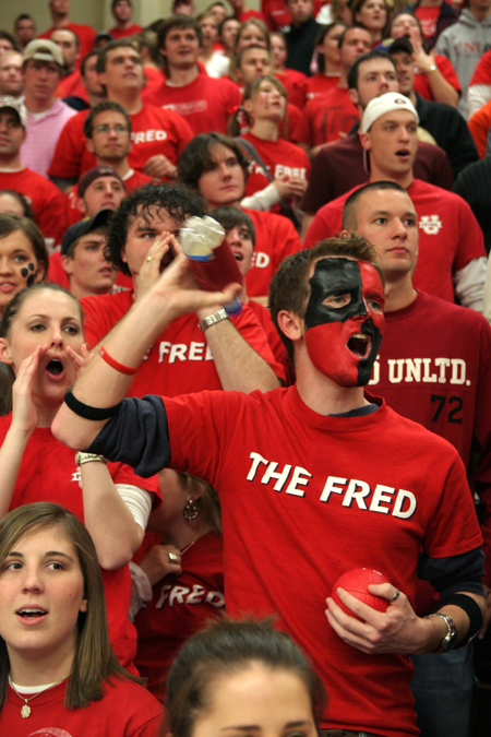 Freshman Matt Taylor and a throng of students wearing their <em>The Fred</em> t-shirts cheer on the Bulldogs against Lambuth. <em>The Fred</em> stands for the Fred DeLay Gymnasium. - Photo by Kyle Kurlick