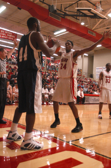 Junior forward Deywane Lee (24) guards against the inbounds pass in Union win over Lambuth. - Photo by Heather Phillips