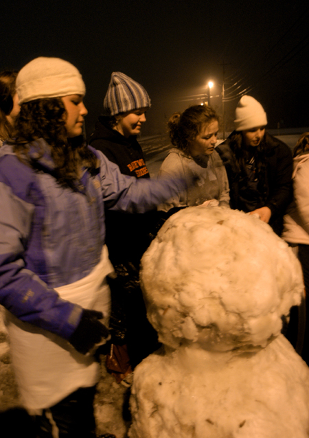 A group of friends make a mean snowman. - Photo by Heather Phillips