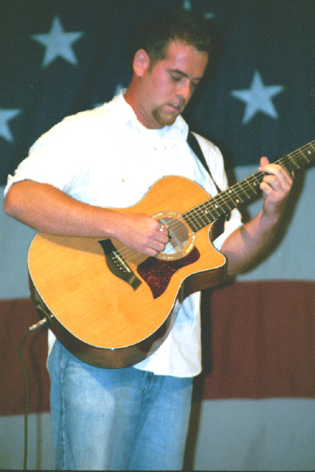 Senior Music major Jason Hamlin provides some musical entertainment during the intermission of the SAC Variety Show. - Photo by Lindsay Stavish