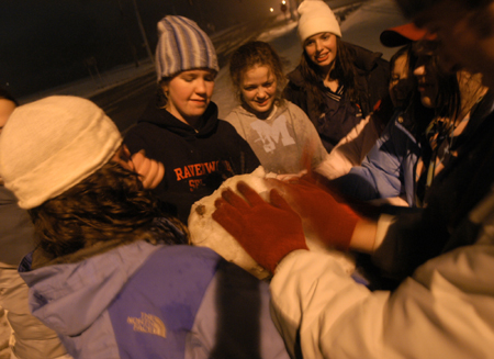 Katrina Parker, Candra Pennington, Emily Blackketter and friends make a snowman. - Photo by Heather Phillips