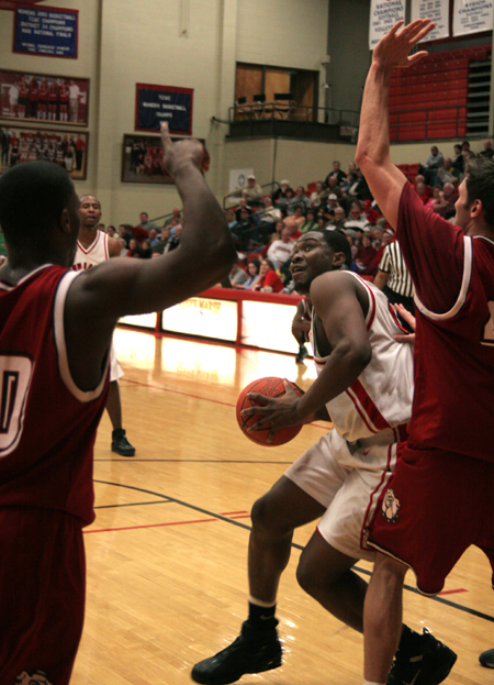 Pierry Valmera of Union looks to get a shot off in the paint in Union 74-63 win over Cumberland. - Photo by Kyle Kurlick