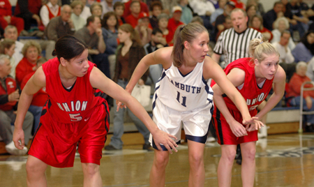 Tiffany Fisher (5) and Crystal Eason (3) block out during a free throw attempt in a game versus Lambuth. - Photo by Brad Moore