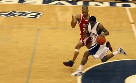 Senior guard Rod Ross races down the court step for step with a Lambuth player. - Photo by Steven Aldridge