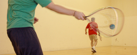Senior Matt Owen and Jim Veneman, instructor of communication arts, play a friendly game of racquetball. - Photo by Brad Moore