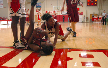 Jessica Graves follows a Cumberland player to the floor in hopes of getting a loose ball. - Photo by Brad Moore