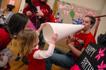 Senior Landon Preston demonstrates the use of a megaphone for the Thornbury girls. - Photo by Brad Moore