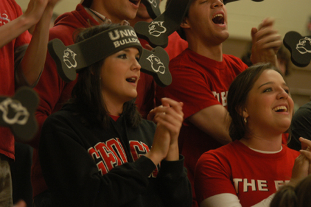 Freshmen Hannah Holliday and Kelly Northam catch the bulldog spirit during the Cumberland home game. - Photo by Heather Phillips
