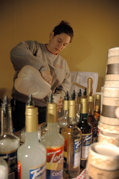 Hurt resident director Emma Wall works with Level Grounds to prepare coffee for students at the Homecoming Coffeehouse. - Photo by Brad Moore