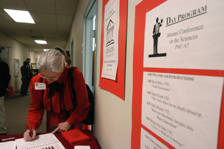 Mrs. Marjorie Tuck signs in at the Alumni Conference on the Sciences, an annual Homecoming event. - Photo by Heather Phillips
