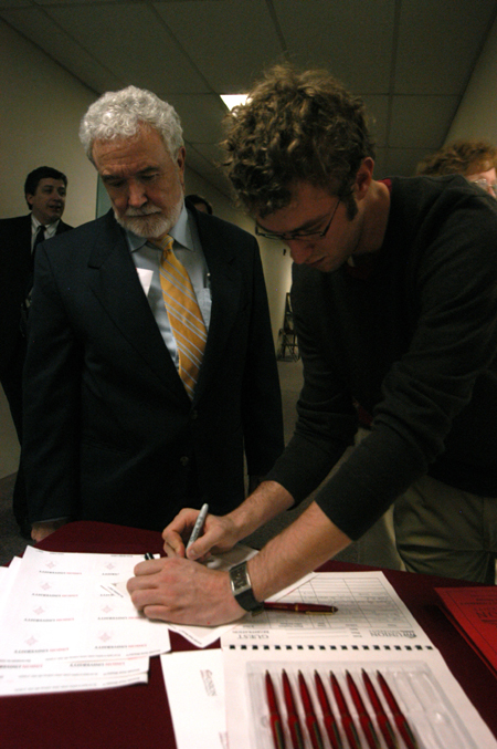 Former Chemistry Faculty Member Robert Cantrell and Student Hunter Stepp sign in at the Alumni Conference on the Sciences, an annual Homecoming event. - Photo by Heather Phillips