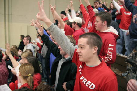 Fans celebrate a three-point shot during the Homecoming game against Mountain State. - Photo by Kyle Kurlick