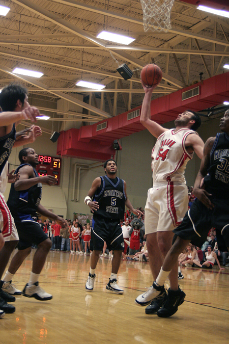 Junior center Ben Frederick (54) yanks down a long rebound from a missed free throw in Union's win over Mountain State (W. Va.) at Homecoming 2006. - Photo by Kyle Kurlick
