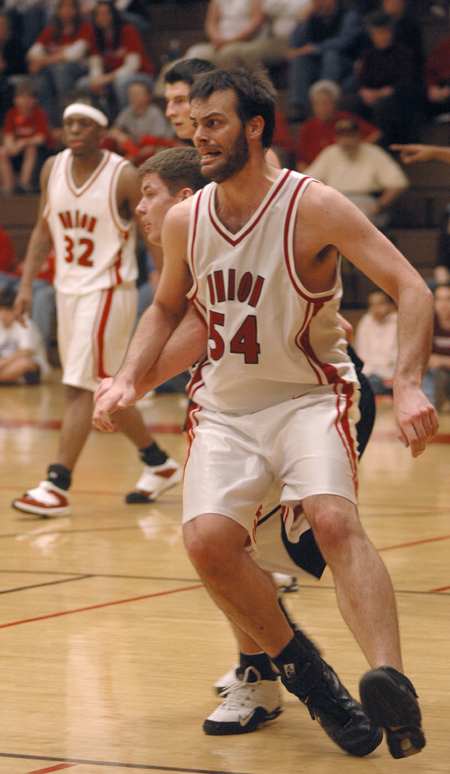 Ben Frederick (54) tries to post up against a defender.   - Photo by Brad Moore